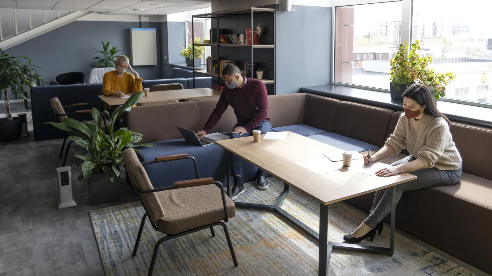 Employees working at a safe distance in a coworking space