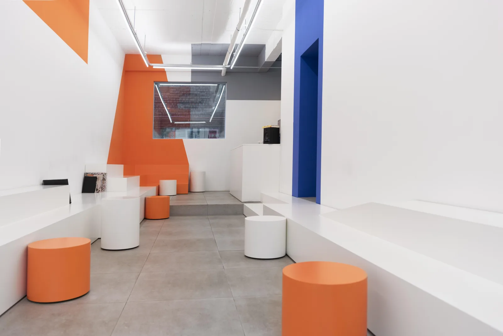 Characterful interior with bold orange and blue graphic volumes