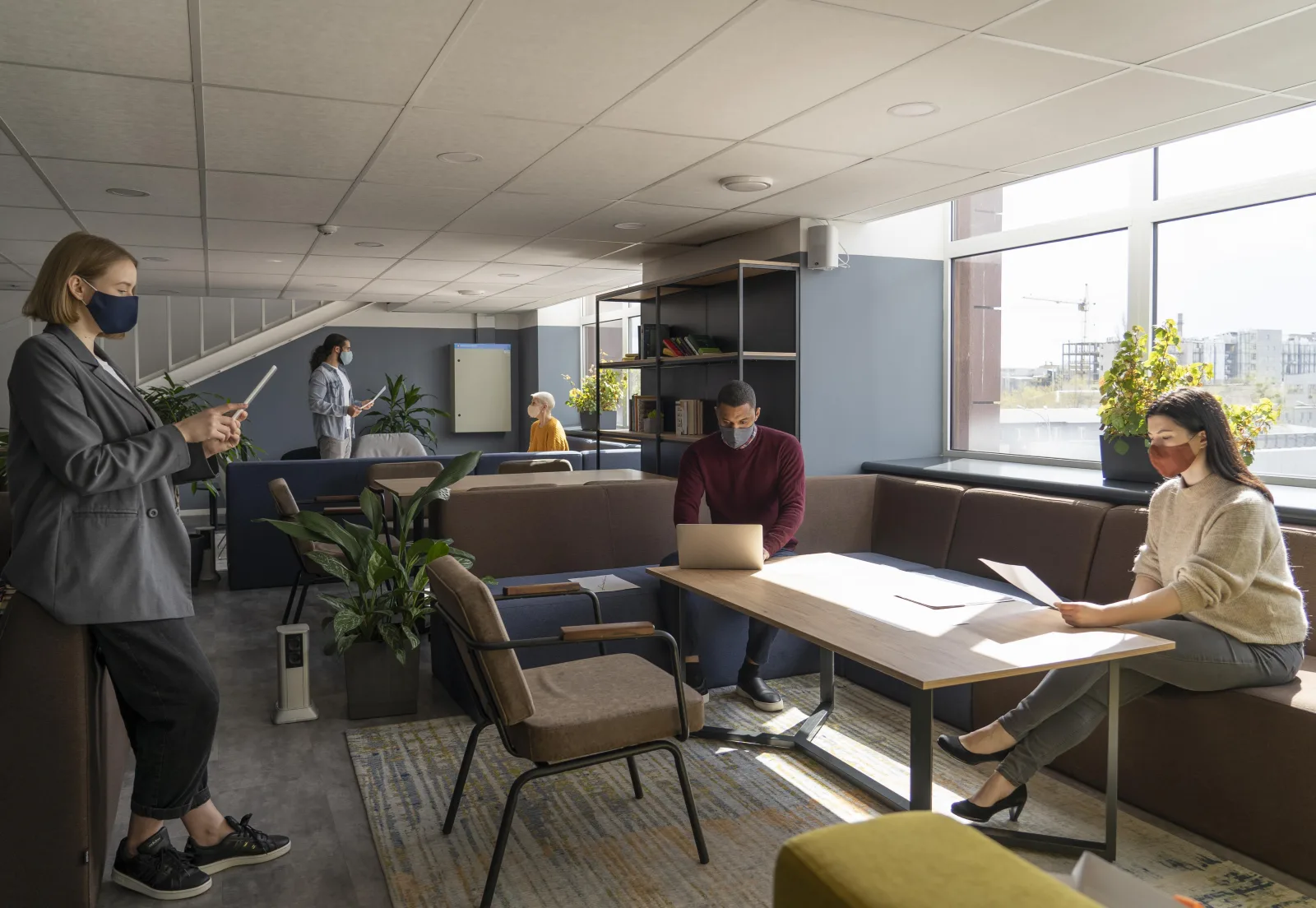 Employees working at a distance in a bright office